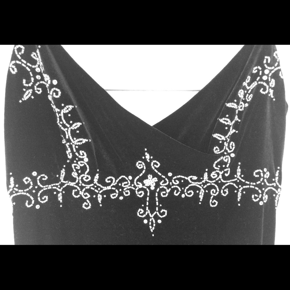 Floor length black gown. Velvet and fine beading.
